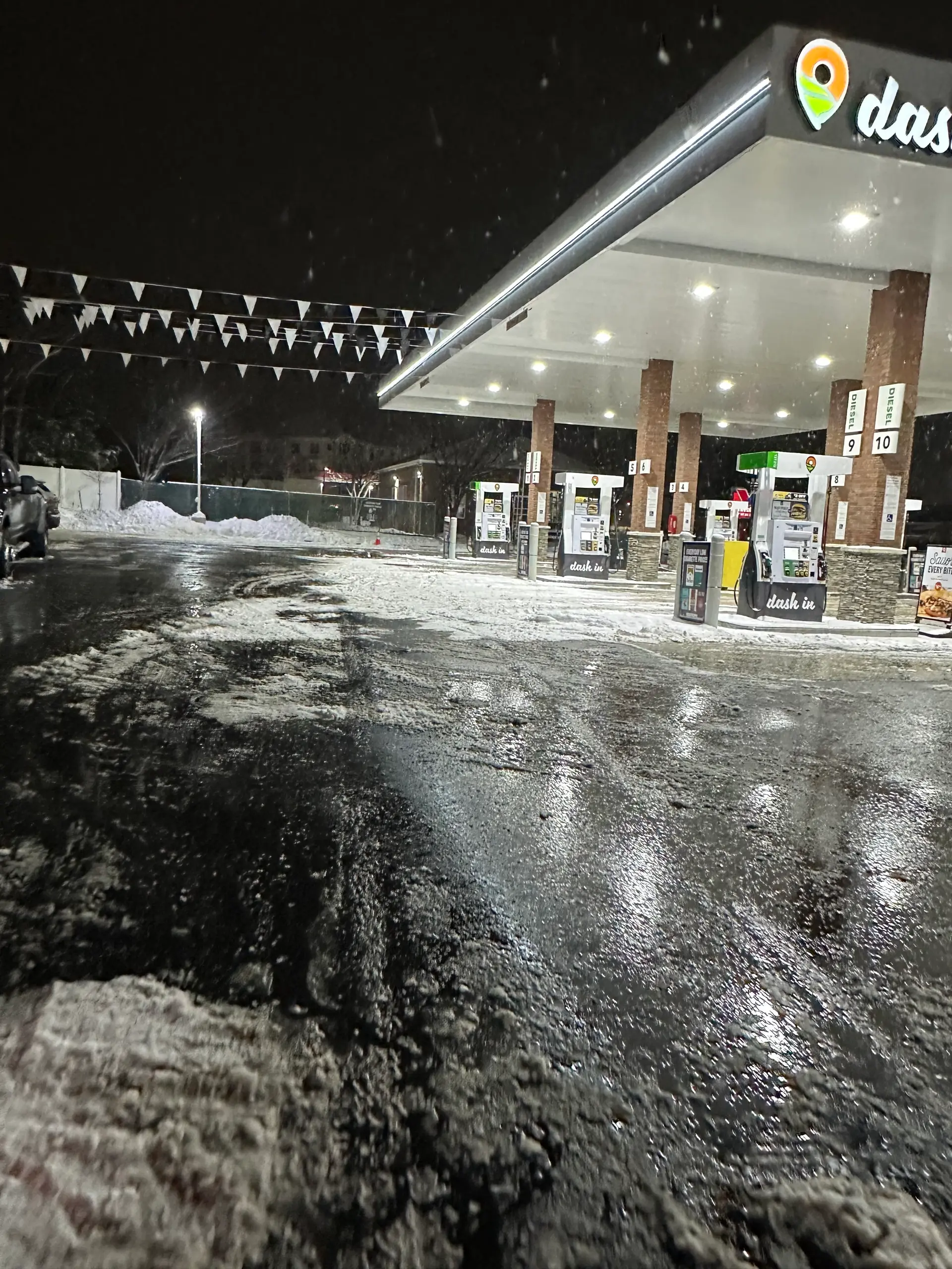Overnight commercial snow removal at a Maryland gas station by Prism Contracting